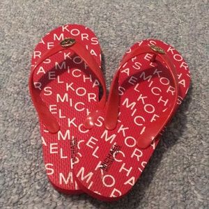 Red Michael Kors flip flops